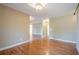 Bright living room with hardwood floors and neutral paint, offering a spacious and inviting atmosphere at 6365 Mountain View Trl, Cumming, GA 30041
