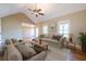 Inviting living room features wood floors, vaulted ceilings, and comfortable seating at 6365 Mountain View Trl, Cumming, GA 30041