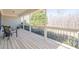 Inviting porch with wooden flooring and black railings, perfect for relaxing outdoors at 6365 Mountain View Trl, Cumming, GA 30041