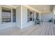 Charming, covered front porch with wood flooring, offering an inviting outdoor space at 6365 Mountain View Trl, Cumming, GA 30041