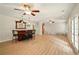 Basement featuring wood-look floors, a bar area with seating, and french doors, perfect for entertaining at 8056 Revere Dr, Mcdonough, GA 30252