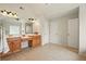 Bright bathroom with double vanity, neutral walls and tile flooring at 8056 Revere Dr, Mcdonough, GA 30252