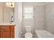 Bathroom featuring white vanity and gray tiled shower and tub at 8056 Revere Dr, Mcdonough, GA 30252