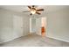 Bedroom with carpet and ceiling fan with doorways to adjacent rooms at 8056 Revere Dr, Mcdonough, GA 30252