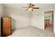 Bedroom with carpet, window, closet, and access to hall at 8056 Revere Dr, Mcdonough, GA 30252