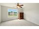 Bedroom with carpet, large window, and dresser at 8056 Revere Dr, Mcdonough, GA 30252