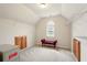 Large walk-in closet featuring built-in shelving, storage cabinets and seating at 8056 Revere Dr, Mcdonough, GA 30252