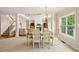 Formal dining space featuring tile floors and a staircase view at 8056 Revere Dr, Mcdonough, GA 30252
