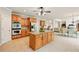 Open concept kitchen with stainless appliances, center island, breakfast area, and lots of natural light at 8056 Revere Dr, Mcdonough, GA 30252