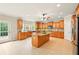 Spacious kitchen featuring custom wood cabinets, large center island with granite, and stainless steel appliances at 8056 Revere Dr, Mcdonough, GA 30252
