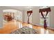 Bright living room featuring hardwood floors, area rug, and elegant curtains at 8056 Revere Dr, Mcdonough, GA 30252