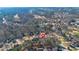 Aerial view of the community features ponds, golf course, tennis courts and plenty of trees at 8424 Fairway Dr, Covington, GA 30014
