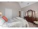Spacious bedroom with a large window, dresser, and a comfortable bed at 8424 Fairway Dr, Covington, GA 30014