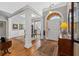 Traditional foyer features hardwood floors, arched doorway, white columns and classic furnishings at 8424 Fairway Dr, Covington, GA 30014