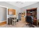 Well-lit home office featuring neutral color scheme, wood furnishings, and a comfortable workspace at 8424 Fairway Dr, Covington, GA 30014