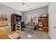 Bright home office featuring natural light, a ceiling fan, wood furnishings, and a neutral color scheme at 8424 Fairway Dr, Covington, GA 30014