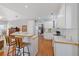Kitchen featuring white cabinets, wood countertops, and hardwood flooring at 8424 Fairway Dr, Covington, GA 30014