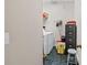 Functional laundry room featuring modern appliances, storage shelves, and durable flooring at 8424 Fairway Dr, Covington, GA 30014
