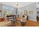 Inviting living room with hardwood floors, large windows, neutral walls and elegant furnishings at 8424 Fairway Dr, Covington, GA 30014