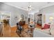 Classic living room featuring hardwood floors, neutral paint and decor, with traditional furnishings at 8424 Fairway Dr, Covington, GA 30014
