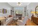 Bright living room with hardwood floors, large windows, neutral walls and elegant decor at 8424 Fairway Dr, Covington, GA 30014