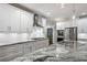 Modern kitchen featuring granite countertops, stainless steel appliances, and white cabinets at 2262 Abby Ne Ln, Atlanta, GA 30345