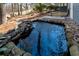 Beautiful water feature with rock accents enhancing the peaceful ambiance of the backyard at 2421 Spring Lake Dr, Marietta, GA 30062