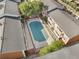 Birds eye view of brick apartment buildings, rooflines, balconies, landscaping, and covered pool at 885 Briarcliff Ne Rd # 16, Atlanta, GA 30306