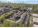Aerial view of a brick apartment complex with a covered pool and mature trees at 885 Briarcliff Ne Rd # 16, Atlanta, GA 30306