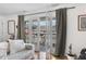 Living room balcony offers a glimpse of the neighborhood and natural light at 885 Briarcliff Ne Rd # 16, Atlanta, GA 30306