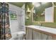 Charming bathroom with colorful shower curtain and an arched mirror at 885 Briarcliff Ne Rd # 16, Atlanta, GA 30306
