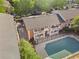 Aerial view of the brick condo building, showing the balconies, roof and covered pool at 885 Briarcliff Ne Rd # 16, Atlanta, GA 30306