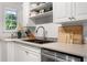 Bright and functional kitchen with stainless steel appliances, double sink, and wooden cutting boards at 885 Briarcliff Ne Rd # 16, Atlanta, GA 30306