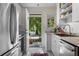 Bright kitchen with stainless steel appliances and open doorway to outdoor area at 885 Briarcliff Ne Rd # 16, Atlanta, GA 30306