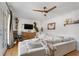 Inviting living room featuring hardwood floors, a ceiling fan, and balcony access at 885 Briarcliff Ne Rd # 16, Atlanta, GA 30306
