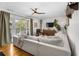 Open living room with hardwood floors and balcony access through French doors at 885 Briarcliff Ne Rd # 16, Atlanta, GA 30306