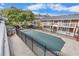 View of the covered pool, landscaped grounds and brick condo buildings with balconies at 885 Briarcliff Ne Rd # 16, Atlanta, GA 30306