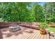 Backyard featuring deck, benches and a firepit area, ideal for outdoor entertaining at 97 Old Burnt Hickory Rd, Acworth, GA 30101