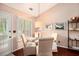 Bright dining area with white shutters, complemented by neutral tones and wood flooring at 97 Old Burnt Hickory Rd, Acworth, GA 30101