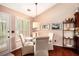 Bright dining area with white shutters, complemented by neutral tones and wood flooring at 97 Old Burnt Hickory Rd, Acworth, GA 30101