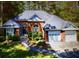 Charming brick home with an attached garage and mature landscaping at 97 Old Burnt Hickory Rd, Acworth, GA 30101