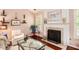 Inviting living area showcasing hardwood floors, a fireplace, and stylish decor at 97 Old Burnt Hickory Rd, Acworth, GA 30101