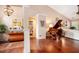 Open concept living area featuring hardwood floors, a piano, and natural lighting at 97 Old Burnt Hickory Rd, Acworth, GA 30101