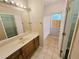 This bathroom includes a sink, mirror and tub at 1059 Sims Sw St, Atlanta, GA 30310