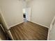 This bedroom features wood floors and an open doorway at 1059 Sims Sw St, Atlanta, GA 30310