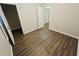 This bedroom features wood floors and an open doorway at 1059 Sims Sw St, Atlanta, GA 30310