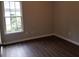 Bedroom featuring new vinyl flooring, a window and neutral walls at 1059 Sims Sw St, Atlanta, GA 30310