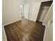 A large bedroom view features wood-look floors and multiple doorways at 1059 Sims Sw St, Atlanta, GA 30310