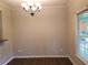 Dining room with decorative chandelier and view to backyard at 1059 Sims Sw St, Atlanta, GA 30310