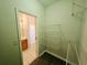 A view of the hallway showcases a bathroom and the closet at 1059 Sims Sw St, Atlanta, GA 30310